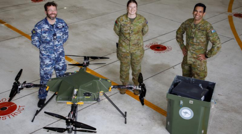 Sergeant Bradlee Ledger, Lieutenant Odette Swaine and Flight Lieutenant Saurav Kataria during a demonstration of the air delivery drone known as Aladdin at RAAF Base Edinburgh, SA. Story by Flight Lieutenant Holly Ryan. Photo by Flight Sergeant Rob Hack.