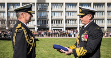 Outgoing Chief of the Defence Force (CDF) Admiral David Johnston hands over the CDF ensign to incoming CDF Admiral Mark Hammond during a ceremonial parade at Russell Offices, Canberra. Story by Sergeant Matt Bickerton. Photo by Kym Smith.