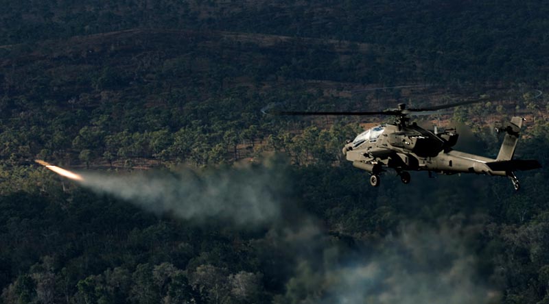An Australian AH-64E Apache from 1st Aviation Regiment conducts gunnery activities during Exercise Possum Guns at Townsville Field Training Area. Photo by Sergeant Samuel Miller.