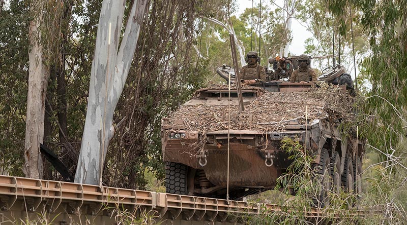 An Australian Army Boxer combat reconnaissance vehicle drives over a Dry Support Bridge during Exercise Talisman Sabre 23. Photo by Corporal Nicole Dorrett.