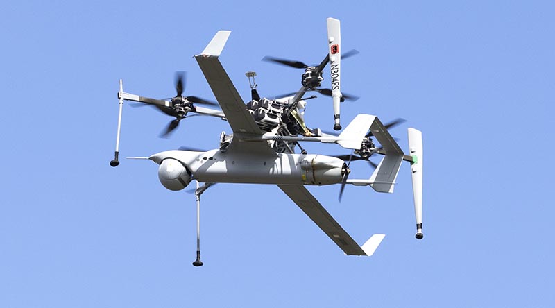 The flying launch and recovery system (FLARES) carries an Integrator UAV to launch altitude during a vertical-take-off-and-landing (VTOL) capability display at Jervis Bay Airfield. Photo by Leading Seaman Danyellah Hill.