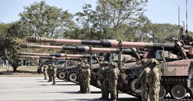 AS9 Huntsman self-propelled howitzer crews stand in review order awaiting inspection during a parade marking the new artillery system's introduction into service as Army's first protected mobile fires battery at Lavarack Barracks, Townsville. Photo by Private Gregory.