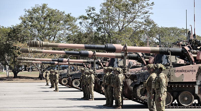 AS9 Huntsman self-propelled howitzer crews stand in review order awaiting inspection during a parade marking the new artillery system's introduction into service as Army's first protected mobile fires battery at Lavarack Barracks, Townsville. Photo by Private Gregory.