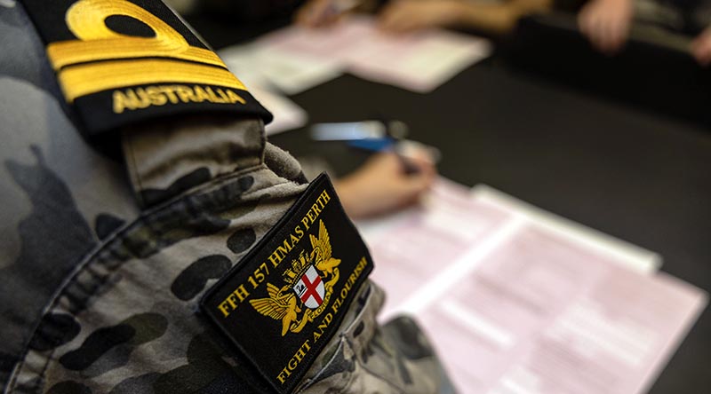 A Royal Australian Navy officer completes the 2026 Australian Bureau of Statistics Census in HMAS Perth during her Indo-Pacific Regional Presence Deployment. Photo by Leading Seaman Connor Morrison.