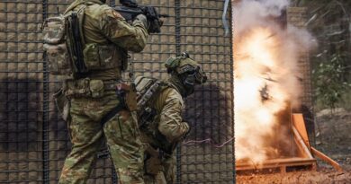 Australian soldiers explosively breach a method-of-entry training door during urban clearance training at Greenbank, Queensland. Photo by Corporal Janet Pan.
