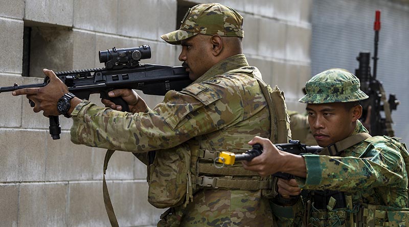 An Australian Army soldier from the 1st Battalion, Royal Australian Regiment, alongside a Royal Brunei Land Forces soldier, conduct urban drills during Exercise Mallee Bull at Lavarack Barracks, Queensland. Photo by Private Alli Craig.