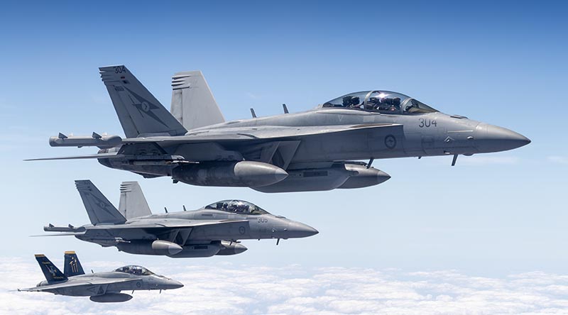 Two Royal Australian Air Force EA-18G Growlers and an F/A-18F Super Hornet queue up for fuel from an air-to-air refuelling tanker during Exercise Pitch Black 26. Photo by Leading Aircraftman Jamie Kohlmann.