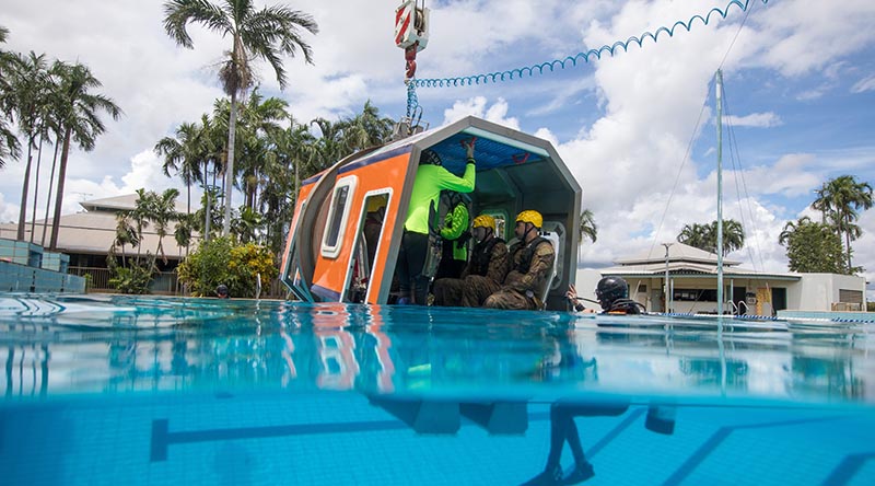 Australian Army soldiers from the 5th/7th Battalion, Royal Australian Regiment, conduct helicopter underwater escape training in a pool at Robertson Barracks, Darwin, Northern Territory. Photo by Corporal Michael Currie.
