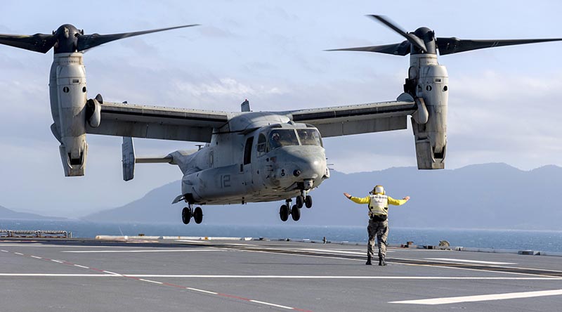 A United States Marine Corps MV-22 Osprey from the Marine Rotational Force - Darwin lands on board HMAS Canberra as part of a force integration training exercise off Queensland, Australia. Photo by Lieutenant Peter Allen.