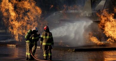 Students attending the Australian Defence Force Fire Fighter Basic Course fight a blaze on a simulated jet fighter at RAAF Base Amberley. Photo by Corporal Brett Sherriff.