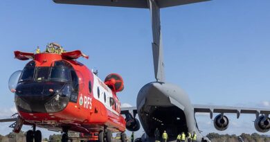 A NSW Rural Fire Service Boeing CH-47D Chinook heavy-lift helicopter is lined up with the ramp of a C-17A Globemaster bound for France at RAAF Base Richmond. Photo by Sergeant Dan Pinhorn.