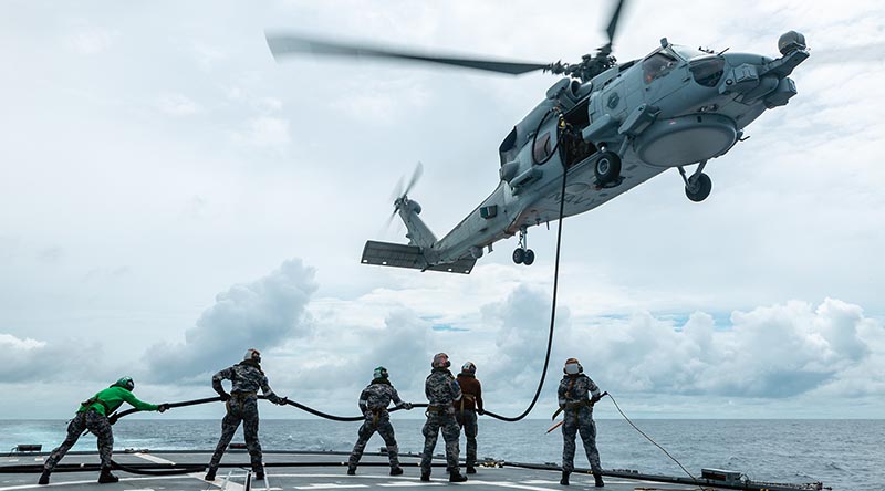 HMAS Ballarat's MH-60R Seahawk 'Mako' takes on fuel during Regional Presence Deployment. Photo by Sub Lieutenant Jake Badior.