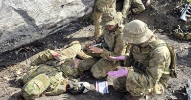 2nd Health Brigade combat medics provide lifesaving treatment to wounded soldiers in a simulated mass-casualty (MASCAS) scenario during Exercise Pozieres Run in Queensland's Shoalwater Bay Training Area. Photo by Captain Chris Wade.