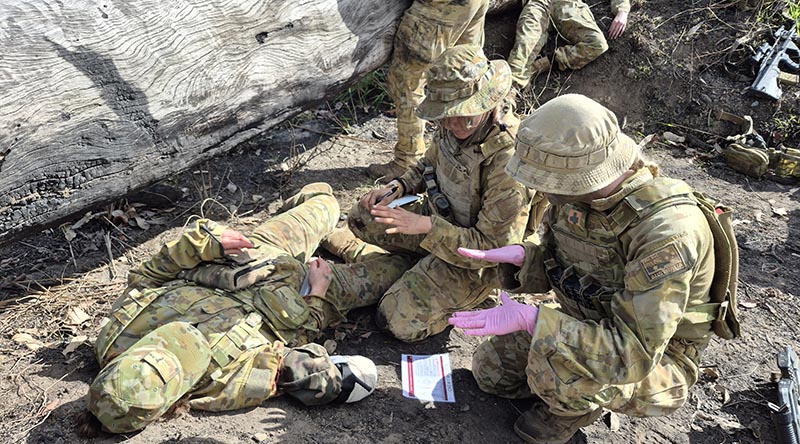 2nd Health Brigade combat medics provide lifesaving treatment to wounded soldiers in a simulated mass-casualty (MASCAS) scenario during Exercise Pozieres Run in Queensland's Shoalwater Bay Training Area. Photo by Captain Chris Wade.