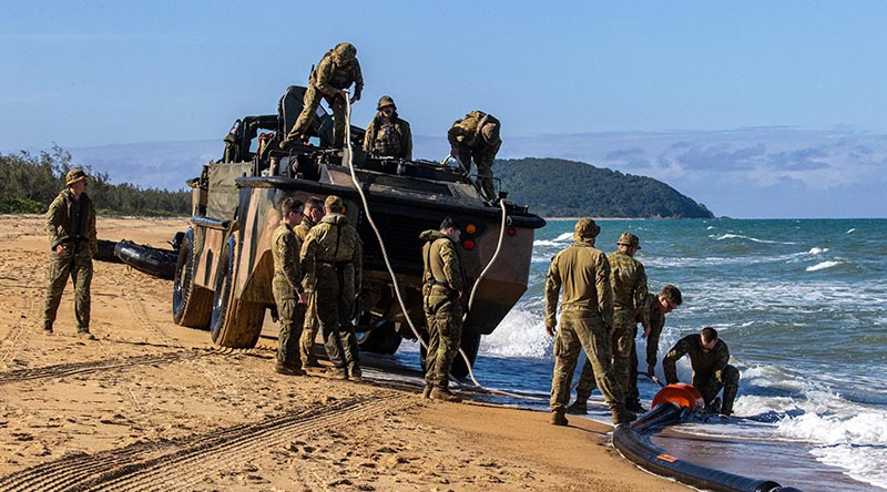 Australian Army soldiers from the 10th Force Support Battalion attach a DRACONE to a Light Amphibious Resupply Cargo Vehicle during Exercise Overland Nautical Petros 26.