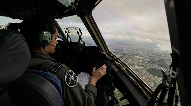 Flight Lieutenant Alisha Follington gets ready to land a C-17A Globemaster III at Tribhuvan International Airport, Kathmandu, Nepal. Photo by Petty Officer Jarrod Mulvihill.
