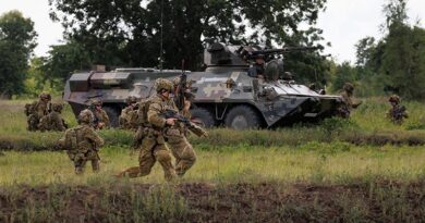 Australian Army soldiers from the 2/30 Training Group dismount from a Royal Thai Army BTR-3E1 armoured personnel carrier during mechanised trench assault training in Lop Buri Province, Thailand during Exercise Chapel Gold 26. Photo by Corporal Lachlan Campbell.