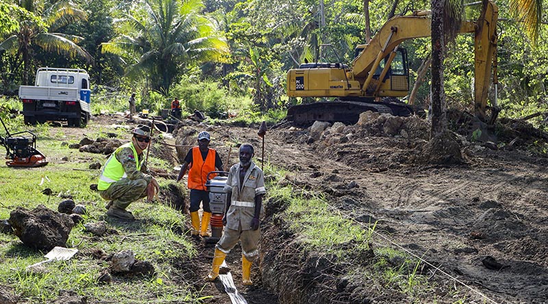 Australian Army Warrant Officer Class Two Matthew Pfingst from 12 Chief Engineer Works discusses the construction of a new sewage system with contractors from Lae Builders and Contractors at Moem Barracks, Wewak, Papua New Guinea. Photo by Lieutenant Emily Tinker.
