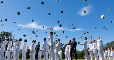 Graduates of the New Entry Officer Course 76 toss their caps in the air in celebration at end of their graduation parade at the Royal Australian Naval College, HMAS Creswell. Photo by Leading Seama Susan Mossop.