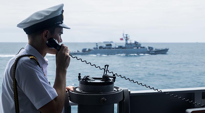 Navigating Officer HMAS Perth, Lieutenant Brynn Mackereth on the bridge wing of HMAS Perth during a passage exercise with HTMS Bangpakong off the coast of Thailand during Perth's 2026 Indo-Pacific Regional Presence Deployment. Photo by Leading Seaman Connor Morrison.