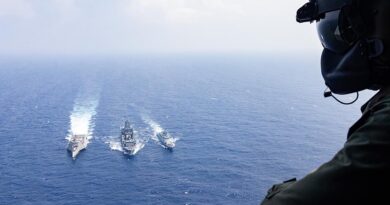 Leading Seaman Justin Howes flies over USS Santa Barbara, HMAS Supply and BRP Diego Silanga during a replenishment at sea off the west coast of Luzon. Photo by Leading Seaman Daniel Heuston.