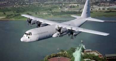 A RAAF C-130J Hercules flies over the Statue of Liberty in New York in the year before the 9/11 terrorist attacks.