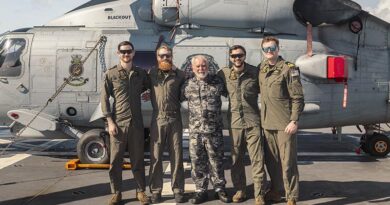 Leading Seaman Daniel Heuston, Lieutenant Noah Learoyd, James Rutledge, Leading Seaman Justin Howes and Lieutenant James Craig following a successful search and rescue mission conducted with HMAS Supply’s embarked MH‑60R Seahawk during Regional Presence Deployment 2026. Photo by Able Seaman Jaxsen Shinners.
