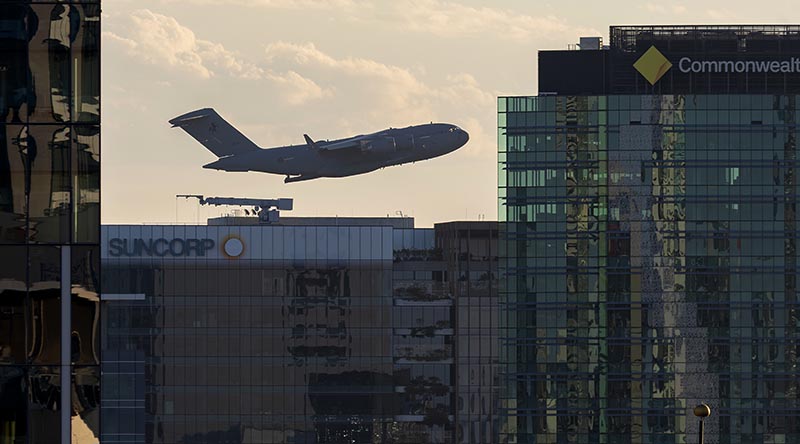 A Royal Australian Air Force C-17A Globemaster III from No. 36 Squadron conducts a flying display over the Brisbane CBD during Riverfire 2026. Photo by Leading Aircraftman Campbell Latch.