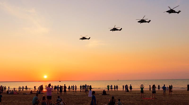 Four Tiger armed reconnaissance helicopter conduct a farewell flyover of Mindil Beach, Darwin. Photographer unknown.