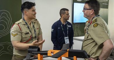 Australian Army soldier Lance Corporal Jamie Dow explains a system to Commander Army Battlelab Colonel Matthew Hodda at the Army Innovation Day stand during the 2026 Chief of Army Symposium. Photo by Corporal Michael Rogers.