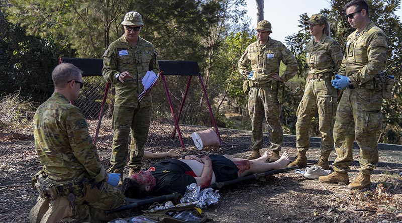 Students on the Emergency Management of Severe Burns (EMSB) course at Gallipoli Barracks, Enoggera, treat a simulated casualty under the supervision of course instructor Major Patrick Weinrauch. Photo by Private Lani Pickering.