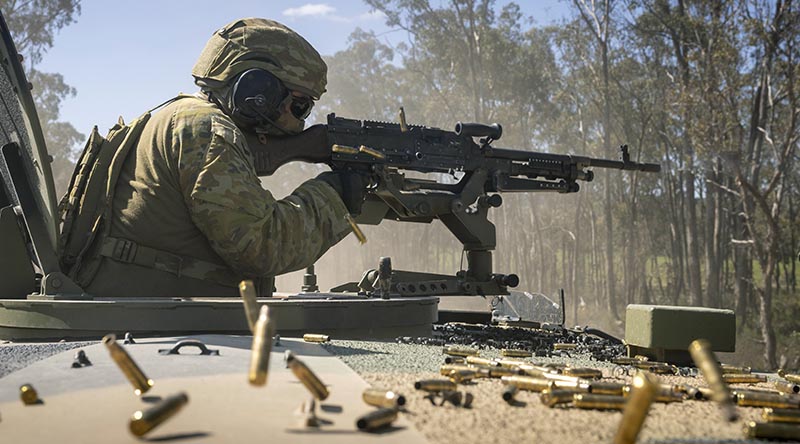 An Australian Army transport soldier defends his convoy on an Army School of Transport defensive-logistics course at Puckapunyal Military Training Area, Victoria. Photo by Leading Aircraftman Chris Tsakisiris.