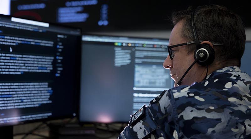 A staff member at the Defence Security Operations Centre. Photo by Jay Cronan.