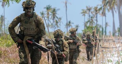Australian Army soldiers prepare to clear an objective following an amphibious landing off HMAS Choules, at Banongan Beach, Indonesia, during Exercise Keris Woomera 2026. Photo by Captain Annie Richardson.