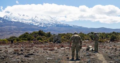 An Australian/New Zealand team begin to clear a safe path into an unexploded-ordnance-hazard zone with handheld metal detectors, during Exercise Safe Step in Waiouru, New Zealand. NZDF photo.