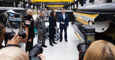 CEO of Anduril David Goodrich, Chief of Navy Vice Admiral Matthew Buckley, Chief Defence Scientist Tanya Monro and Minister for Defence Industry Pat Conroy view a Ghost Shark's payload bay at Anduril's factory in Sydney, New South Wales. Photo by Petty Officer Daniel Goodman.