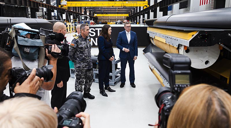 CEO of Anduril David Goodrich, Chief of Navy Vice Admiral Matthew Buckley, Chief Defence Scientist Tanya Monro and Minister for Defence Industry Pat Conroy view a Ghost Shark's payload bay at Anduril's factory in Sydney, New South Wales. Photo by Petty Officer Daniel Goodman.