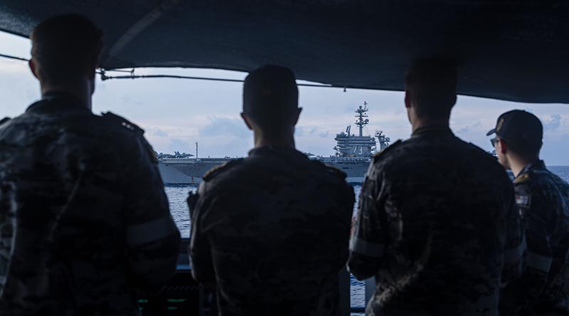 Commanding Officer HMAS Perth, Commander Dylan White and the bridge team on the upper decks of HMAS Perth as she operates alongside USS George Washington during operations in support of Carrier Strike Group 5 (CSG-5) in the South China Sea. Photo by Leading Seaman Connor Morrison.
