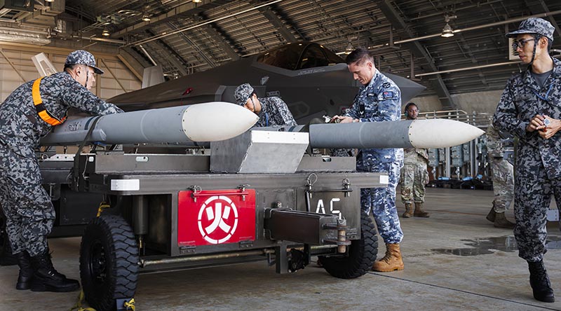 No. 75 Squadron Armament Technician Corporal Luke Corkery assists Japan Air Self-Defense Force personnel as they unload weapons from a JASDF F-35A Joint Strike Fighter at Komatsu Air Base during Exercise Keen Sword 27. Photo by Leading Aircraftman Ivan Smotrov.