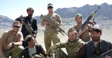 Australian Army snipers from call sign 63-X-ray, 5RAR, with militiamen at an Afghan militia camp in the Chora Valley, Afghanistan. Photo digitally altered for security.