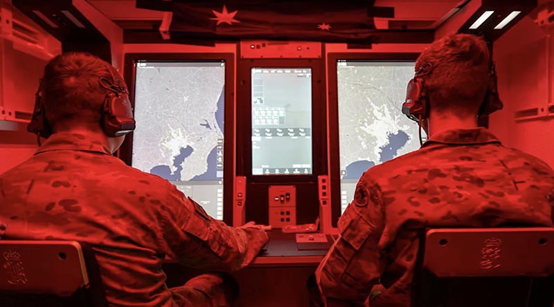 Soldiers from Australia's 1st Division man the Australian NASAMS fire distribution centre during an air defence training simulation with Japan Ground Self-Defense Force and US Army personnel during Exercise Orient Shield at Camp Higashi-Chitose, Japan. Photo by Captain Brodie Cross.