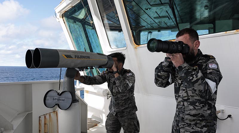 Royal Australian Navy Boatswains Mates Able Seaman Christopher Diviak and Jai Coots survey a vessel from ADV Reliant during Operation Nasse 2026. Photo by Corporal Maddison Scott.
