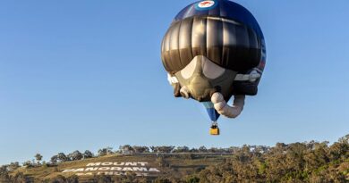A Royal Australian Air Force hot air balloon flies over the iconic Mount Panorama sign during the 2026 Repco Bathurst 1000 at Bathurst, NSW. Photo by Aircraftwoman Grace Hanlon.