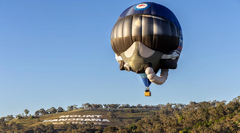 A Royal Australian Air Force hot air balloon flies over the iconic Mount Panorama sign during the 2026 Repco Bathurst 1000 at Bathurst, NSW. Photo by Aircraftwoman Grace Hanlon.