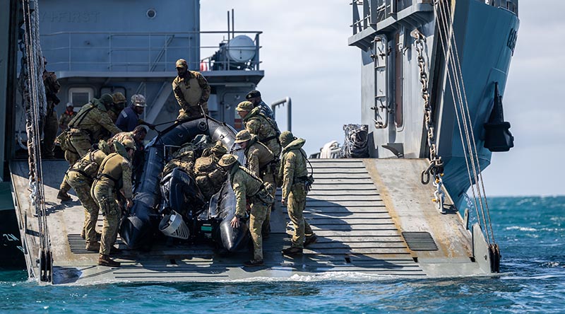 Australian Army soldiers from the 1st Battalion, Royal Australian Regiment, and Papua New Guinea Defence Force soldiers from the 1st Battalion, Royal Pacific Island Regiment, put a Zodiac in the water during Exercise Wantok Warrior 2026 in Papua New Guinea. Photo by Gunner Jesse Linards.
