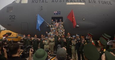 Vietnam People’s Army personnel farewell media before boarding a RAAF C-17A Globemaster III for their deployment to the United Nations Mission in South Sudan. Photo by Corporal Luke Bellman.