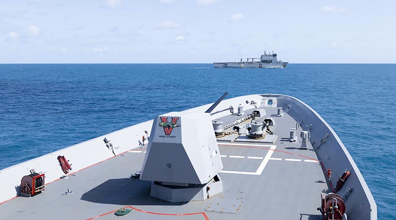 HMAS Sydney (V) sails in company with HMAS Choules off the North Coast of Australia during a Regional Presence Deployment. Photo by Leading Seaman Lauren Pugsley.