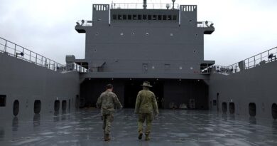 US Army and Australian Army soldiers discuss large landing-craft operations aboard a US Army Runnymede-class boat in Japan. Photo by Gunner Jesse Linards.